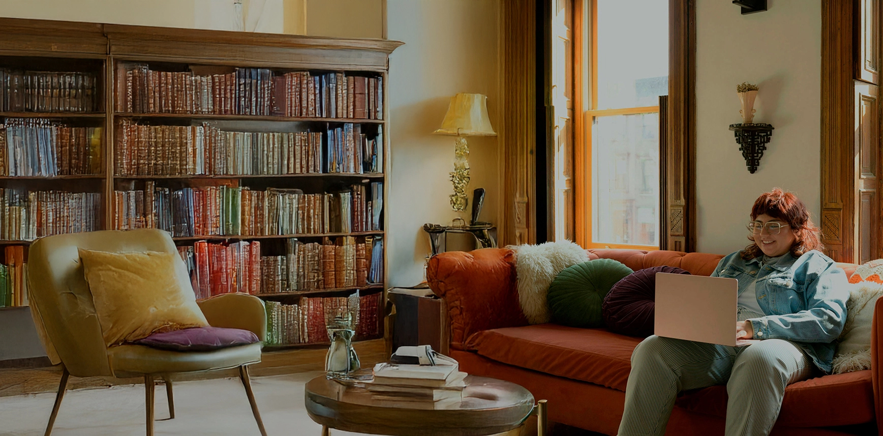 Person using laptop on couch